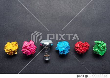 Lightbulb and crumpled colorful paper balls 66332238