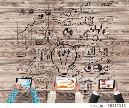 Top view of businesspeople sitting at table and using gadgets 66332316