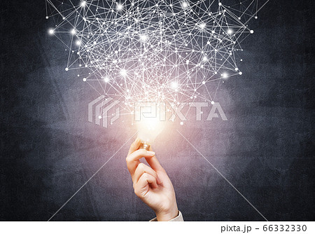 Human hand with glowing lamp and abstract network Human hand with glowing lamp and abstract network 66332330