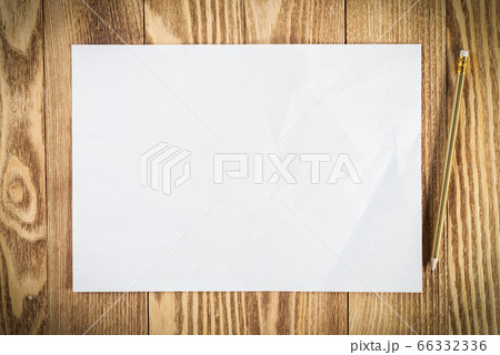 Flat lay wooden table with paper sheet Flat lay wooden table with paper sheet 66332336