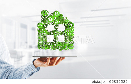 Real estate or construction idea presented by home icon on tablet pc Real estate or construction idea presented by home icon on tablet pc 66332522