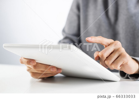 Businesswoman using tablet computer for news read Businesswoman using tablet computer for news read 66333033