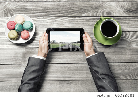 Businesswoman having coffee break Businesswoman having coffee break 66333081
