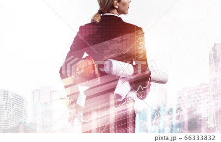 Woman architect with technical blueprints 66333832