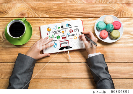 Businesswoman making business notes Businesswoman making business notes 66334395