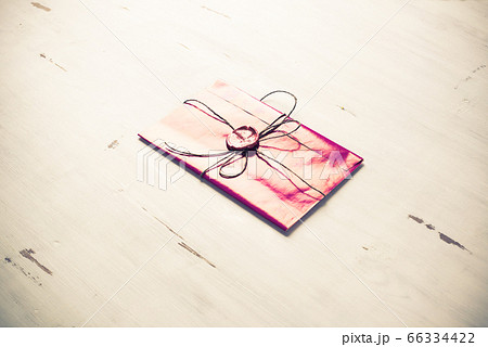 Letter with seal on table 66334422