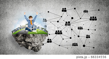 Cute boy of school age with book exploring this great world Cute boy of school age with book exploring this great world 66334556