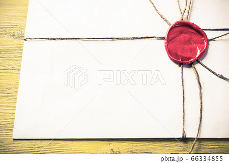 Letter with seal on table 66334855
