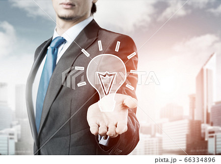businessman holding creativity icon 66334896