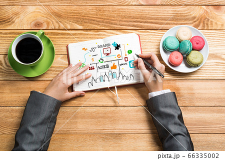 Businesswoman making business notes 66335002