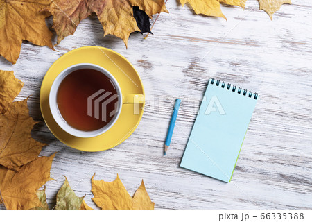 Flat lay autumn composition with cup of black tea 66335388