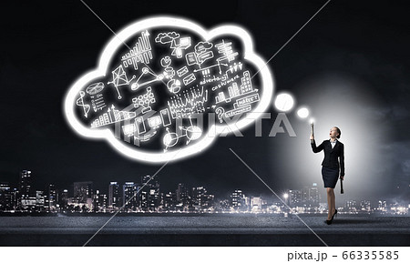 Woman throwing light on her ideas 66335585
