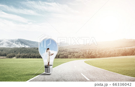 Businesswoman inside light bulb 66336042