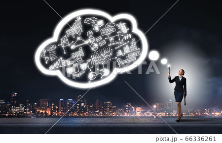 Woman throwing light on her ideas Woman throwing light on her ideas 66336261