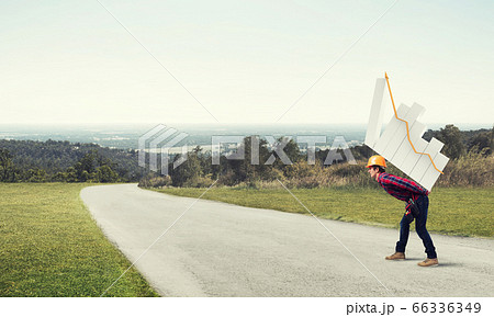 Engineer man carry progress graph Engineer man carry progress graph 66336349