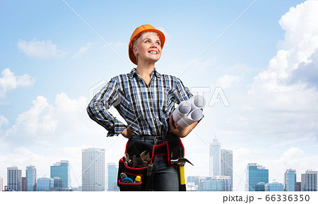 Attractive female engineer in hardhat Attractive female engineer in hardhat 66336350