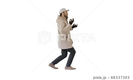 Hip-hop man singing rap, walking and making gestures on white background. Hip-hop man singing rap, walking and making gestures on white background. 66337303