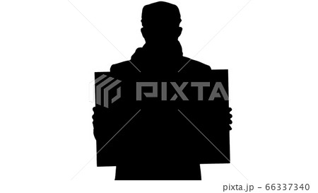 Silhouette Man in a trendy outfit and medical mask holding blank placard. 66337340