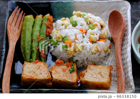 Vietnamese vegan food with fried rice and lotus seed, okra, tofu pie, simple vegetarian meal for non meat diet 66338150