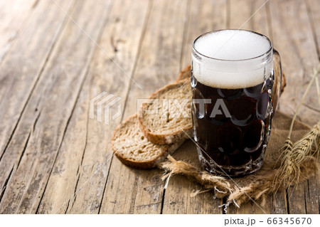 Traditional kvass beer mug with rye bread on wooden table Copy space Traditional kvass beer mug with rye bread on wooden table Copy space 66345670
