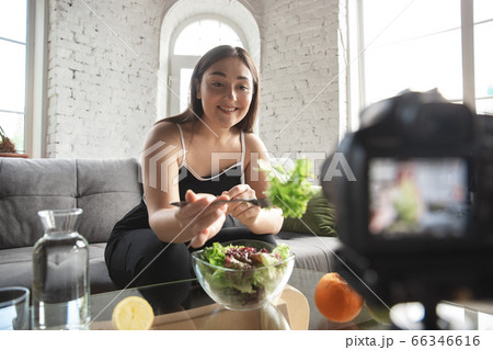 Caucasian blogger woman make vlog how to diet and lost weight. Lifestyle, influencer women, healthy concept. 66346616