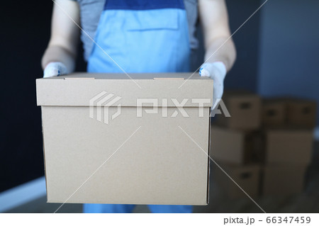 Repairman in protective white glove Repairman in protective white glove 66347459