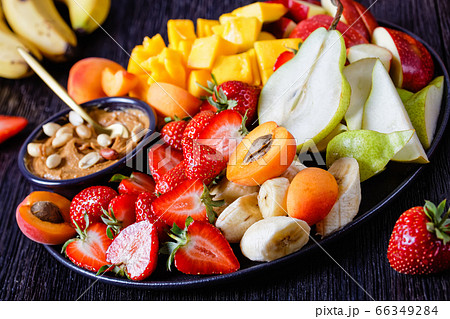 Rainbow fruit platter of fresh fruits and berries 66349284