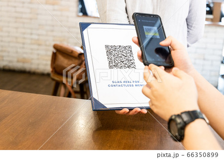 Person scanning contactless menu QR code with new normal 66350899
