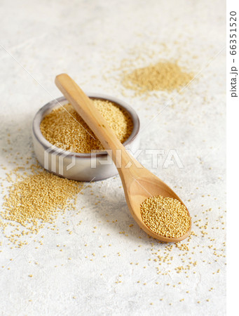 Bowl of raw Amaranth Grain with a spoon 66351520