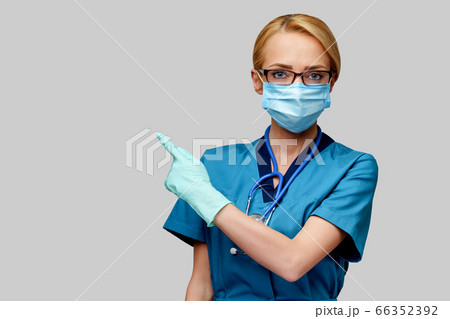 medical doctor nurse woman with stethoscope wearing protective mask and rubber or latex gloves medical doctor nurse woman with stethoscope wearing protective mask and rubber or latex gloves 66352392