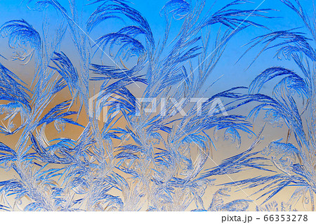 Natural pattern on glass at dawn of the sun. 66353278