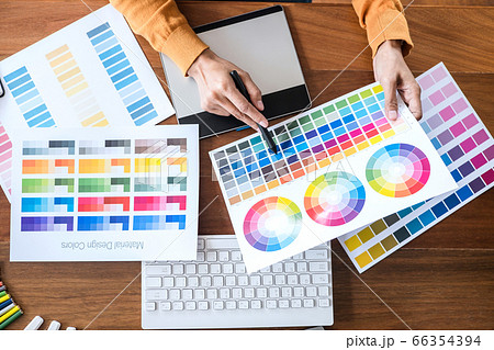 Image of female creative graphic designer working Image of female creative graphic designer working 66354394