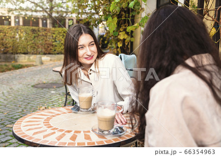 Close-up face of girl looking at her friend oudoor 66354963