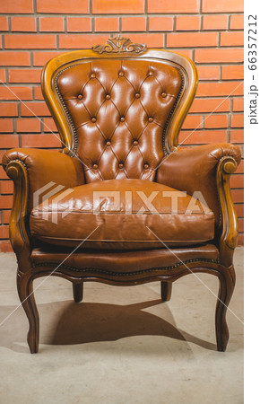 Antique armchair furniture with cushion against Antique armchair furniture with cushion against 66357212