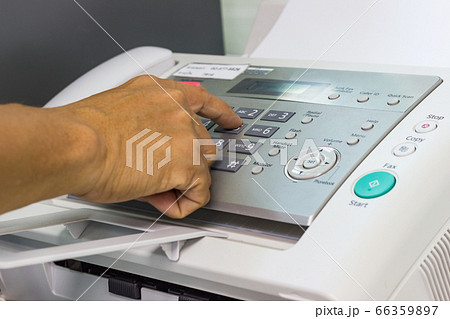 Men are using a fax machine in the office. business concept Men are using a fax machine in the office. business concept 66359897