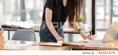 Female designer working with digital devices and 66361976