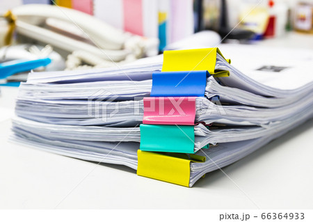 file folder and Stack of business report paper file on the table in a work office, concept document in work office file folder and Stack of business report paper file on the table in a work office, concept document in work office 66364933