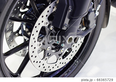 close up - wheel spokes and brake disc of a motorcycle 66365729
