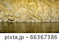 Texture of sea water and relief hard rock wall 66367386