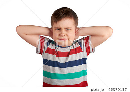 stubborn young kid, covering his closed ears,ignores what they say, asking for silence, isolated on white background 66370157