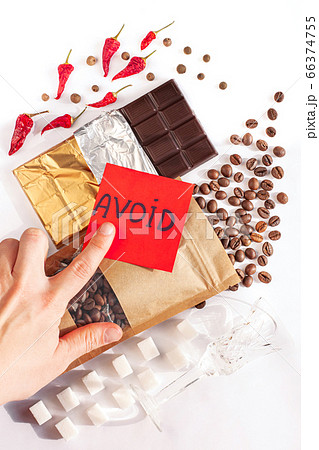Period diet concept, female hand shows sign Avoid. Period diet concept, female hand shows sign Avoid. 66374755