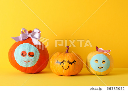 Funny pumpkins on yellow background. Body care 66385052