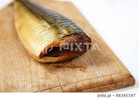 Image of smoked mackerel on kitchen wooden board 66385397