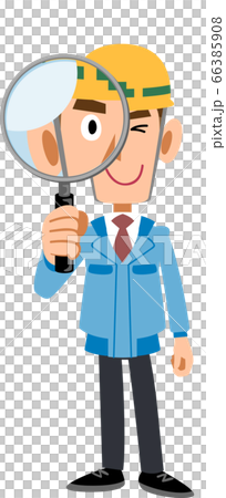 A man in a blue workwear wearing a helmet looking through a magnifying glass 66385908