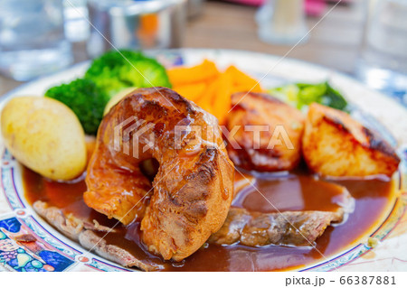 Close up shot of a plate of delicious meat with Close up shot of a plate of delicious meat with 66387881