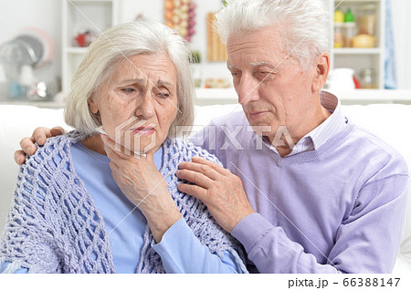 Sick elderly woman and man at home Sick elderly woman and man at home 66388147