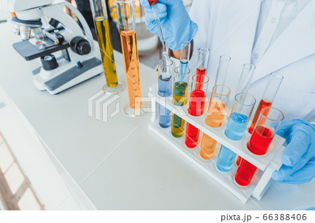 Scientist working on colorful test tube to 66388406