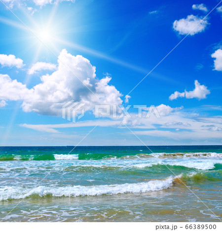 Sea scape and sun on blue sky background. Sea scape and sun on blue sky background. 66389500