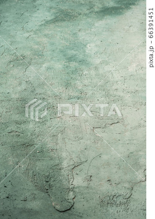 grungy stucco wall background painted with green grungy stucco wall background painted with green 66391451