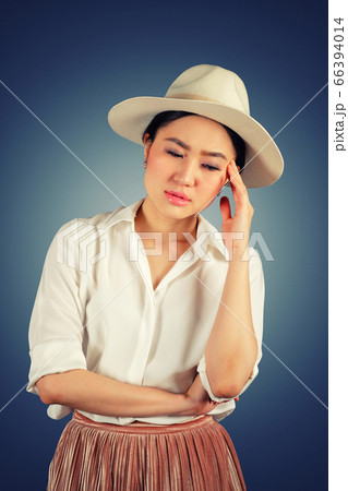 Portrait young woman having headache in dark 66394014